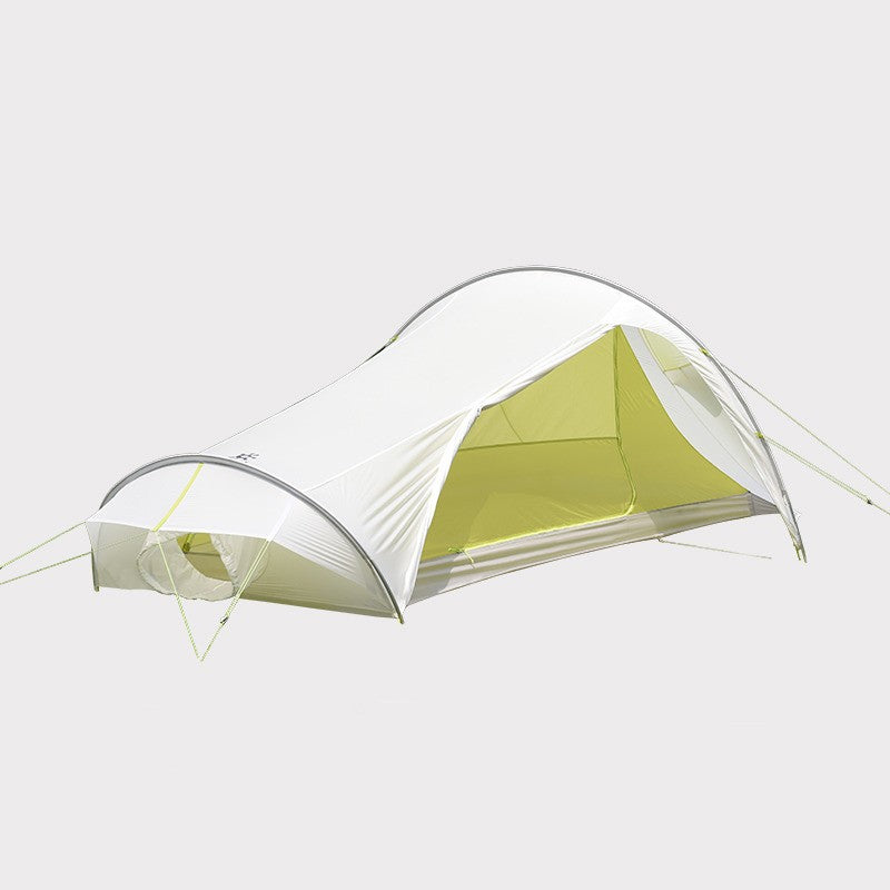 Ultralight white 2-person backpacking tent pitched in the mountains