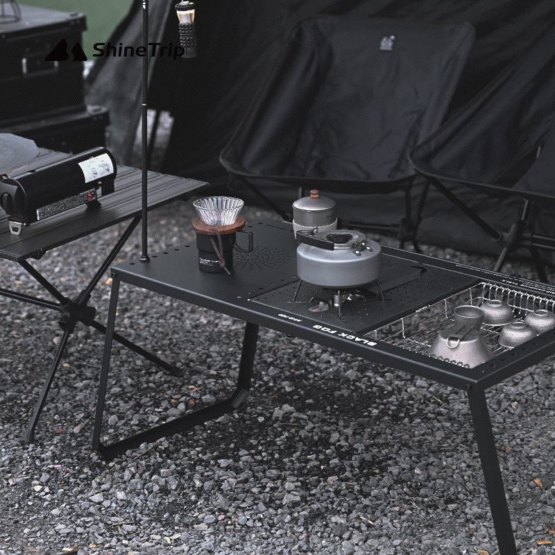 Portable folding camping table set up with modular accessory panels